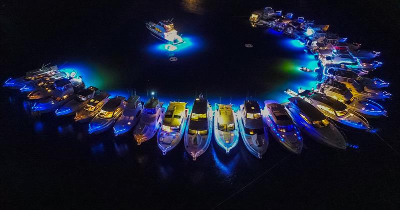 Lasers light up the night sky on the Gold Coast for R Marine Jones raft-up photo copyright Riviera Studio taken at  and featuring the Power boat class