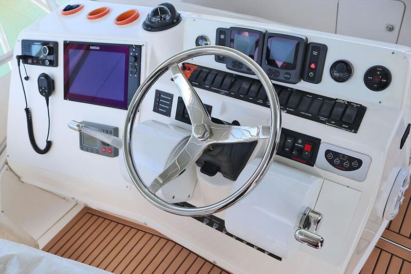 Flybridge complete with Palm-Beach engine controls provides precise maneuverability to assist in the landing of a prized catch onboard 'Reef Raine' - photo © Power Equipment