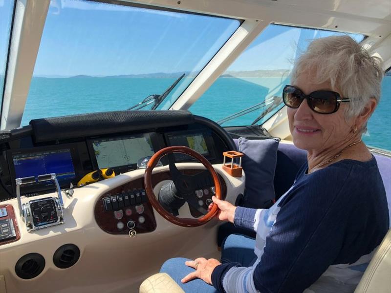 Christina happy at the helm photo copyright Riviera Australia taken at  and featuring the Power boat class