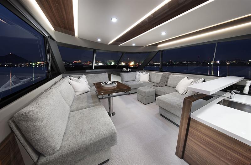 Main Saloon of the new Maritimo M55 - not the cool dining table with angled ends to ensure total walk around capabilities photo copyright Maritimo taken at  and featuring the Power boat class