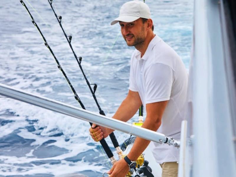 Captain Yury Istomin adjusts the lines aboard his highly customised Riviera 52 Enclosed Flybridge. - photo © Riviera Australia