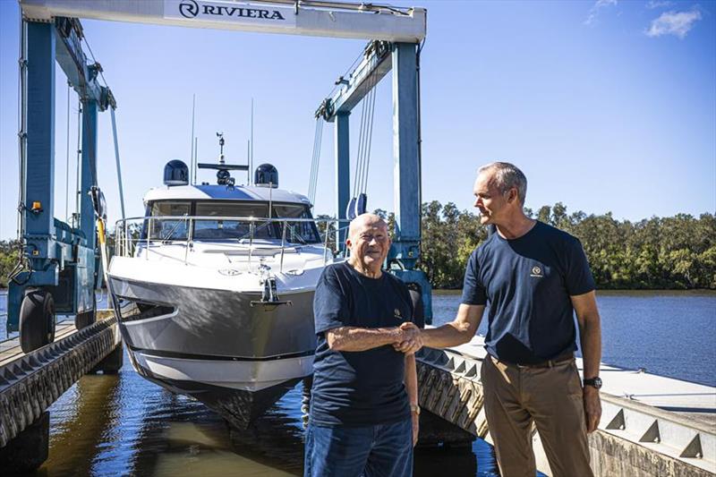 Riviera owner Rodney Longhurst (right) congratulates Peter Haig on the delivery of his 5400 Sport Yacht Platinum Edition, the 6,000th Riviera yacht launched - photo © Riviera Australia