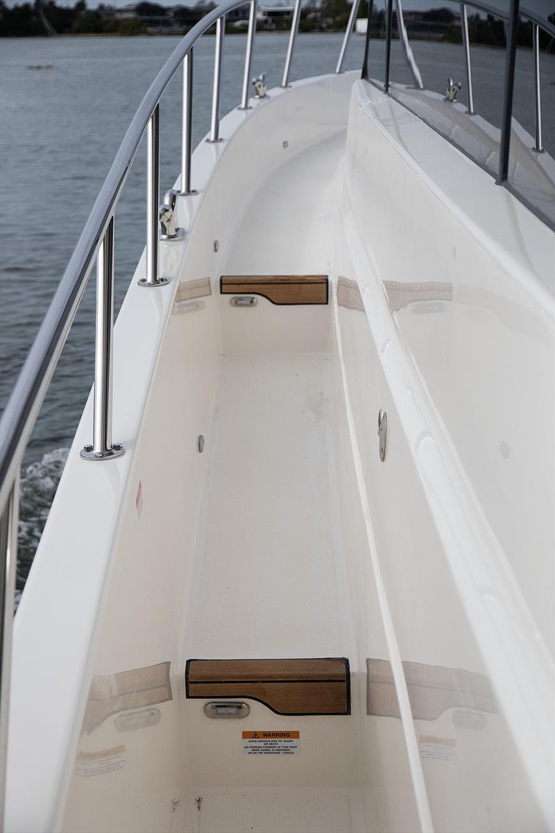 Teak inlay and lighting at the steps for added safety - Maritimo M600 Black Edition - photo © John Curnow