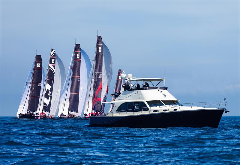 Palm Beach 70 observing the TP52 fleet - photo © Palm Beach Motor Yachts