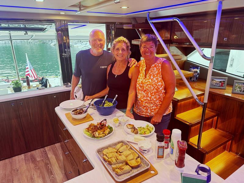 Mark and Isabella in the galley with a cruising friend - photo © Riviera Australia