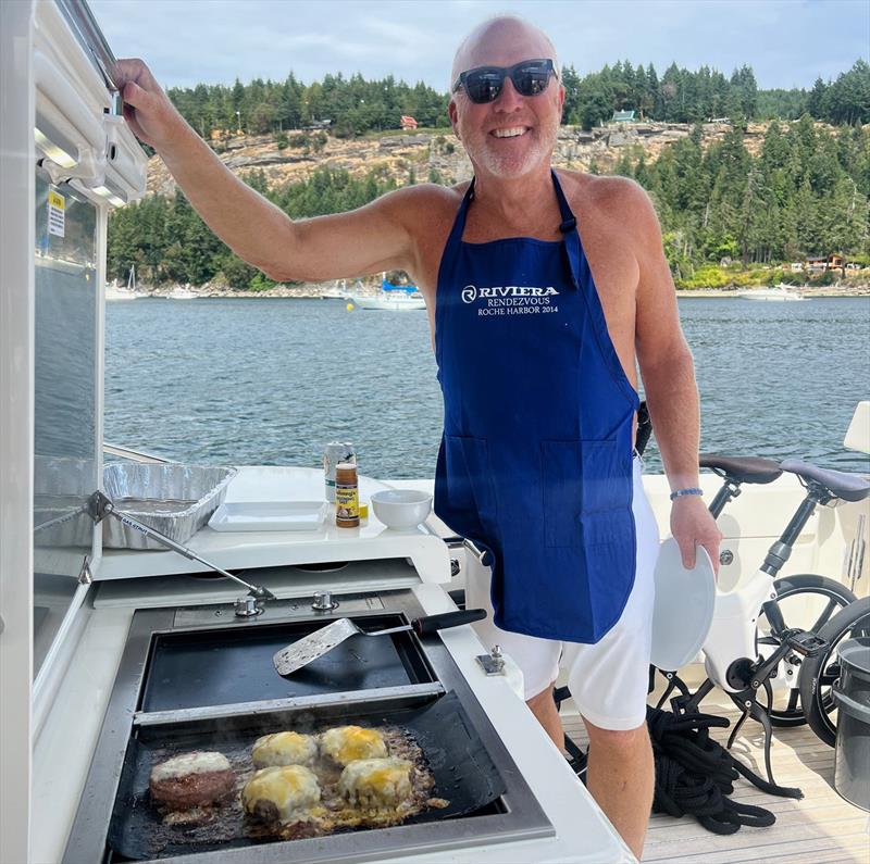 Mark dressed to cook at the yacht's barbecue centre - photo © Riviera Australia