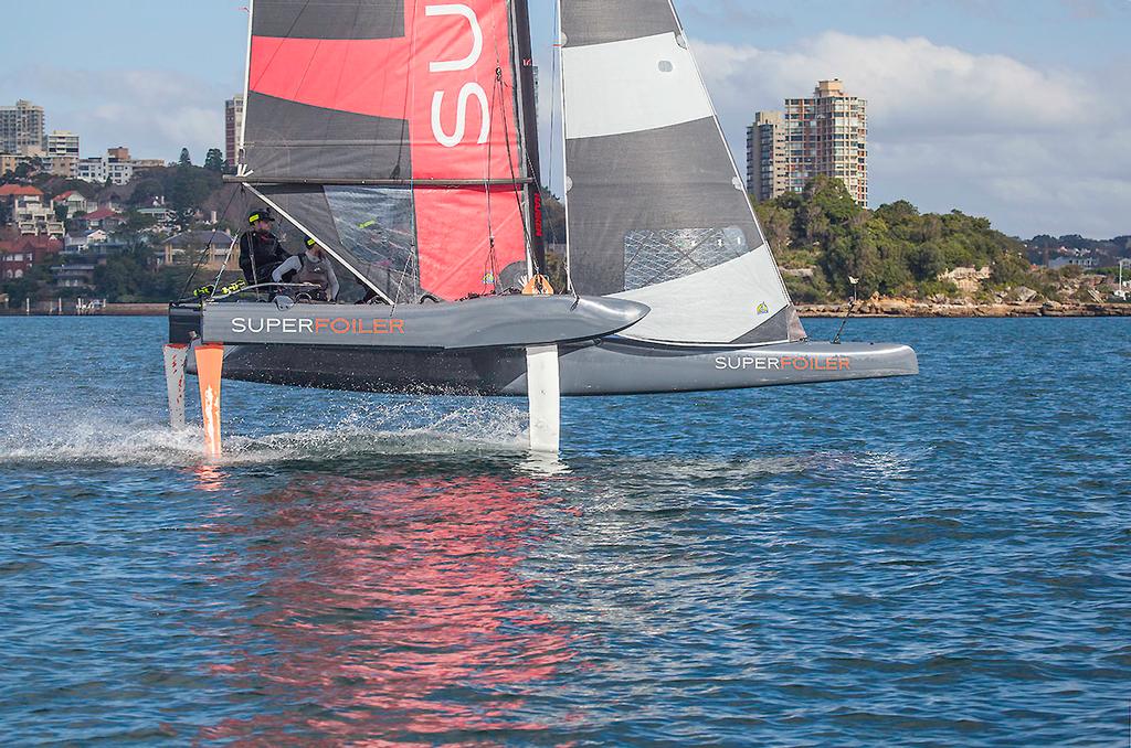 Charging along making 20 knots on Sydney Harbour. Easy! (from the chase boat) ©  John Curnow