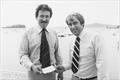 Ted (Chalky) Bland, Commodore of Auckland SC accepts a sponsorship cheque for the 1980 Stubbies 18ft Skiff Championships © Central Leader