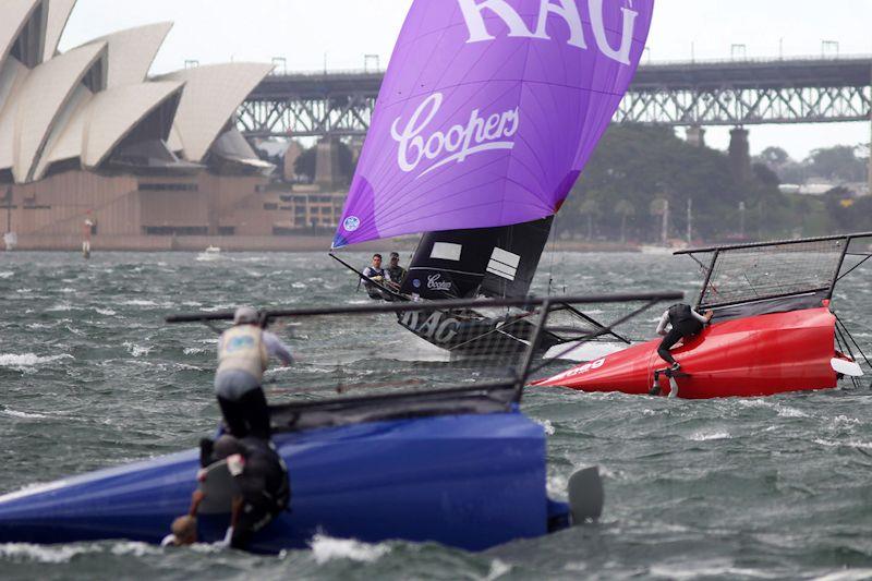 Lead is about to change as Rag and Famish Hotel goes past the capsized Yandoo and Smeg - 18ft Skiff NSW Championship race 5 photo copyright Frank Quealey taken at Australian 18 Footers League and featuring the 18ft Skiff class