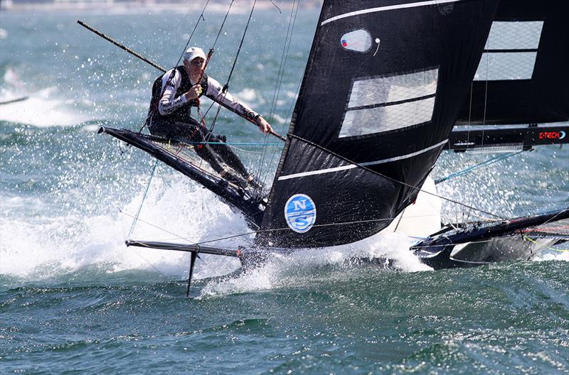 Looks like a one-man crew on an 18 as Simon heads for the bottom mark in a strong southerly wind - photo © Frank Quealey