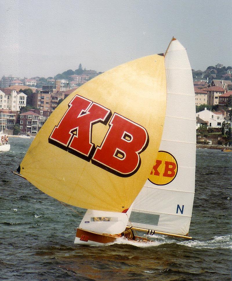Familiar sight of KB skiff with the gold spinnaker and red KB logo - photo © Frank Quealey