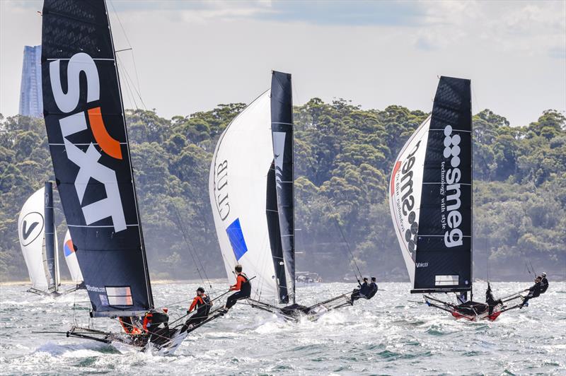 18ft Skiff NSW Championship Day 3 - Chasing the leaders under spinnaker photo copyright SailMedia taken at Australian 18 Footers League and featuring the 18ft Skiff class