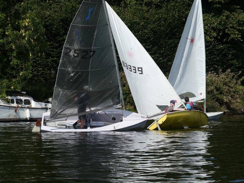 Class winner Nick Titley's Solo (2527) and Ed Cubitt's second-placed Laser at close quarters in the fourth race at at the Minima Regatta 2023, in the background Laser winner Henry Medcalf has his bow just in front photo copyright Rob Mayle taken at Minima Yacht Club and featuring the Solo class