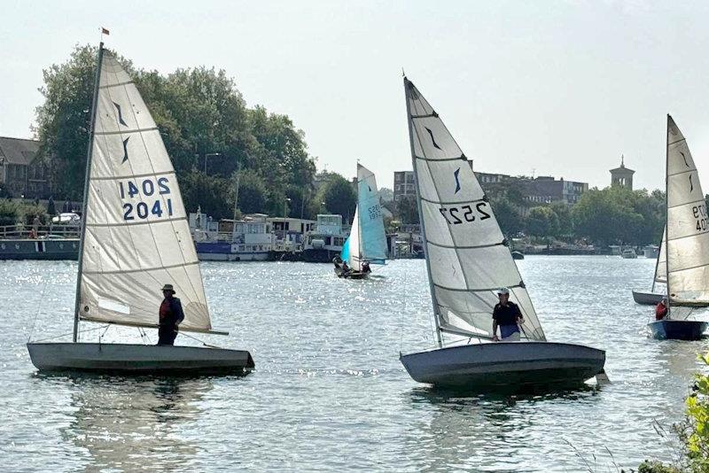 Second-placed John Wilkey (2041) and class winner Nick Titley (2527) silhouetted against the Sunday morning sun - Minima Regatta 2024 - photo © Eileen Barry