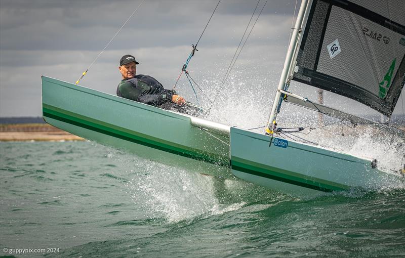 Unicorn and A Class Catamaran Nationals at Hayling Ferry SC: Grant Piggott gets air on the GRP Unicorn, built by his father many years ago, and beautifully restored - photo © Gordon Upton / www.guppypix.com