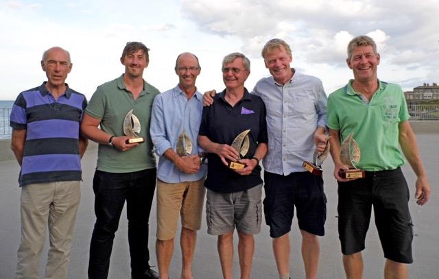 Wayfarer International Championship 2019 podium teams (l-r) Andrew Wilson, Tom Wilson, Simon Townsend, Michael McNamara, Mogens Just and Anders Friis photo copyright Merrin Froggett taken at Greystones Sailing Club and featuring the Wayfarer class